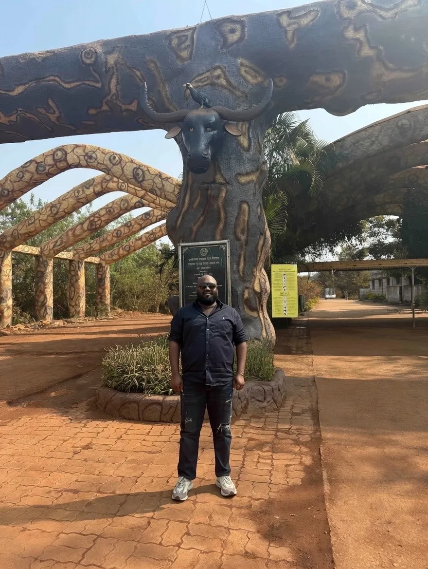 Standing under a sculpted arch
