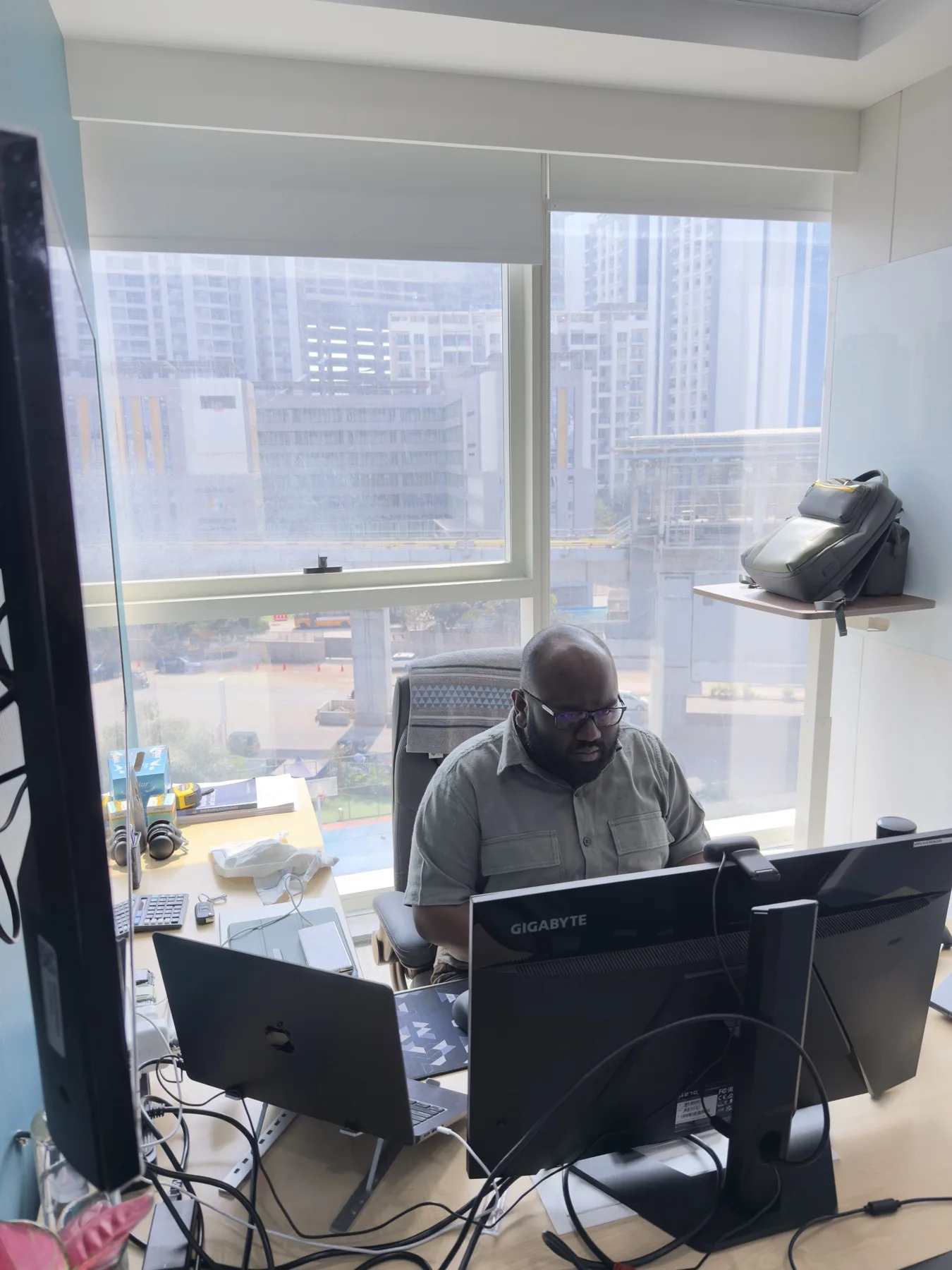 At a desk with a view over the city